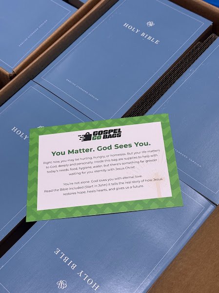Bibles and a Gospel Go Bags encouragement card that reads You Matter, God Sees You